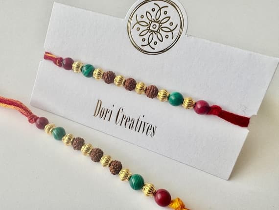 Simple Rudraksha threaded between coloured beads, Rakhri's, Raksha Bandhan, Presented on Gold Foiled Card